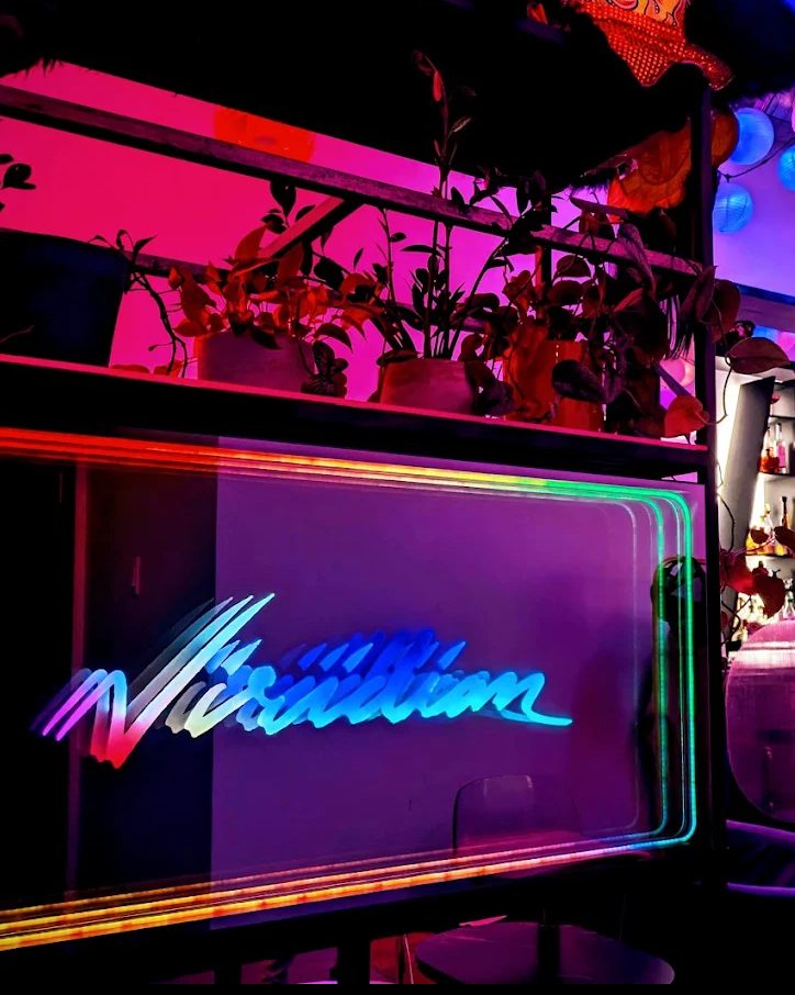 The neon Viridian sign inside the bar